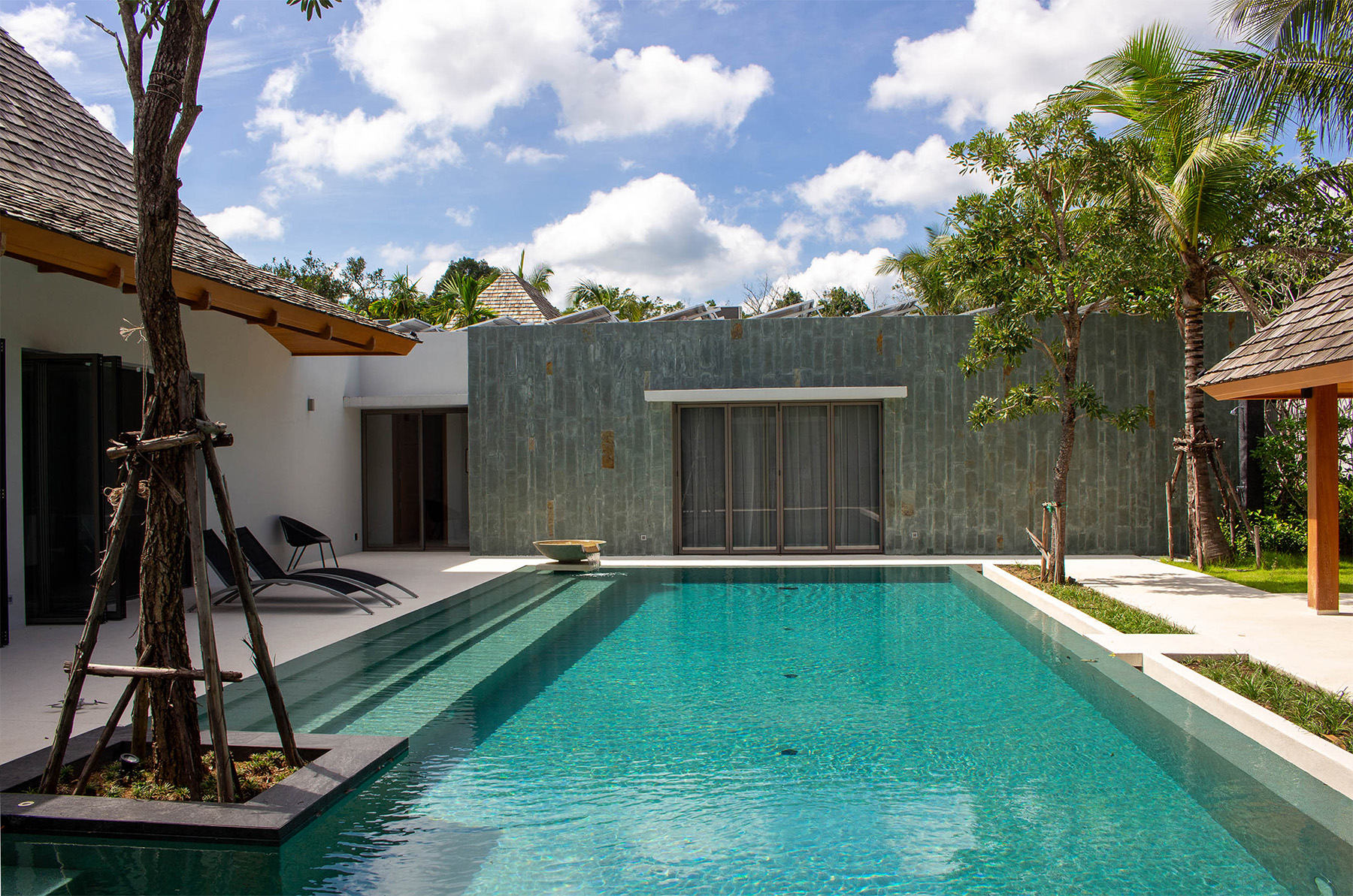 Hotel resort luxury pool with poolside bar and seating area