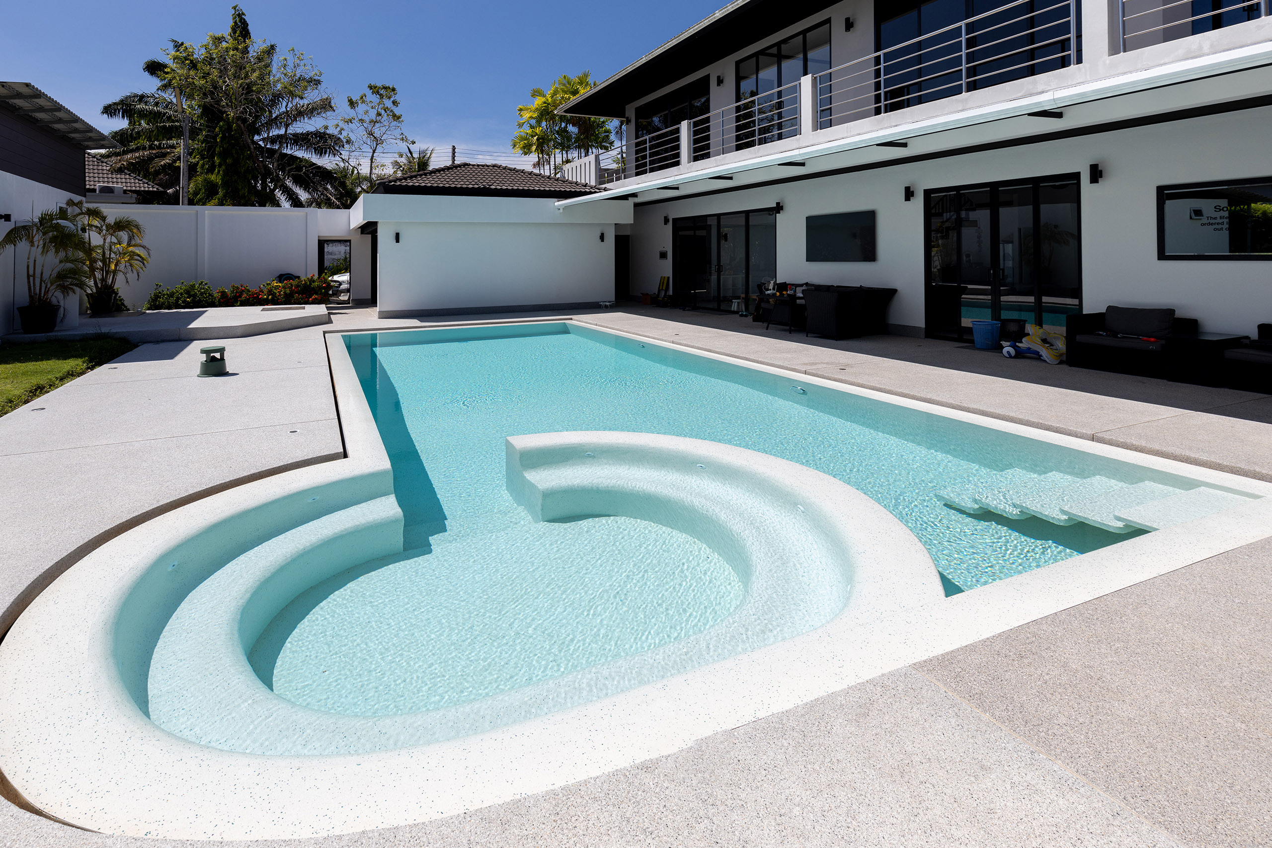 Hotel resort luxury pool with poolside bar and seating area