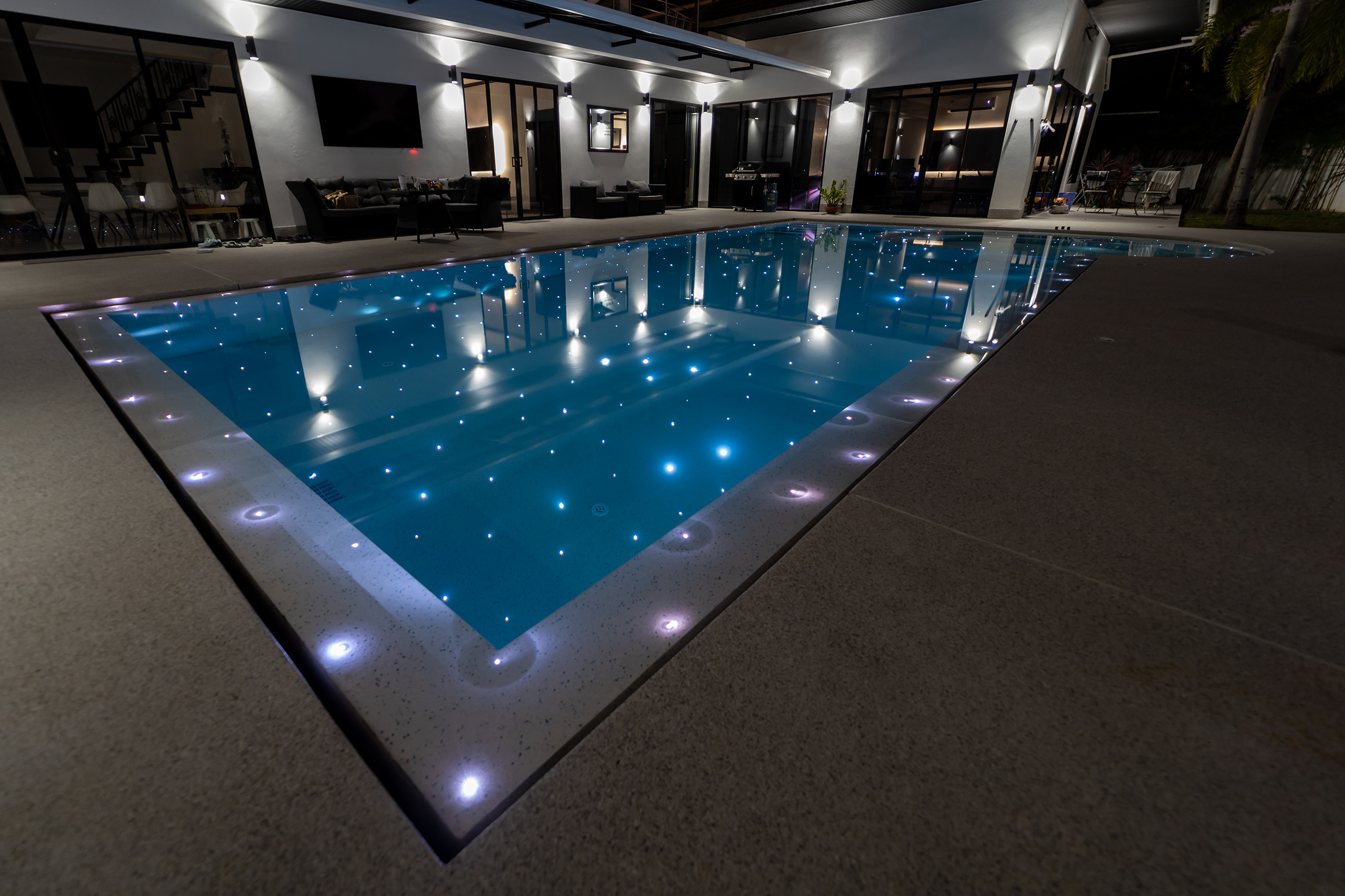 Hotel resort luxury pool with poolside bar and seating area