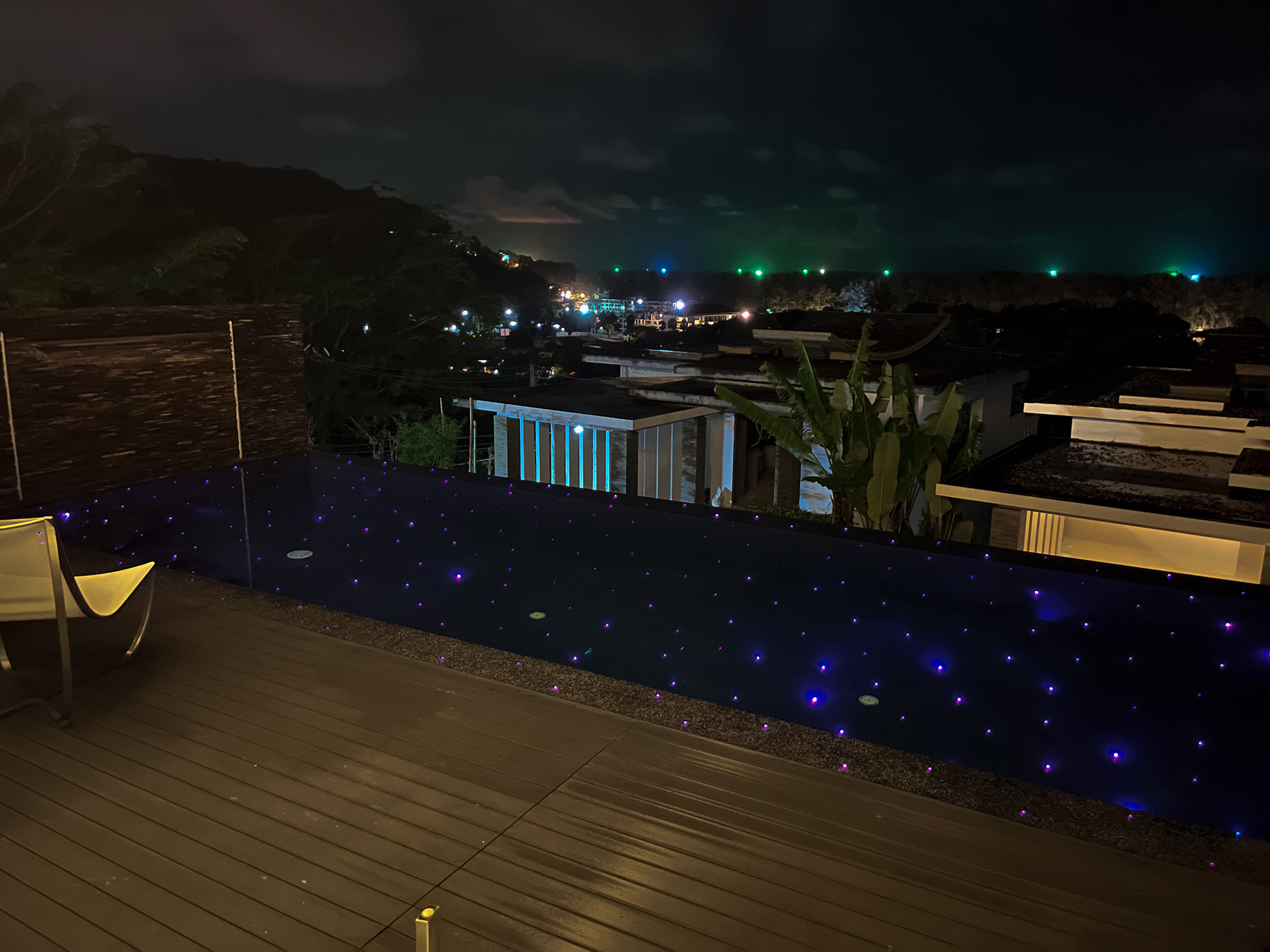 Modern infinity pool with stunning night view in Phuket