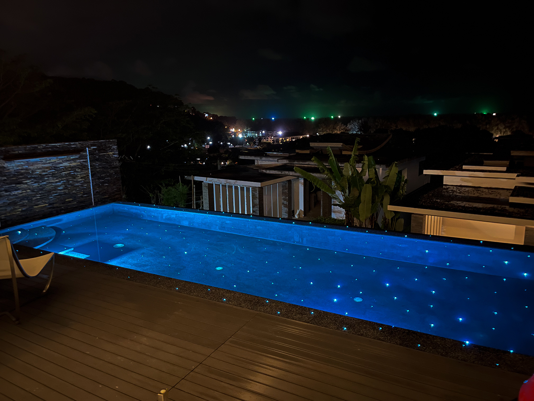 Modern infinity pool with stunning night view in Phuket
