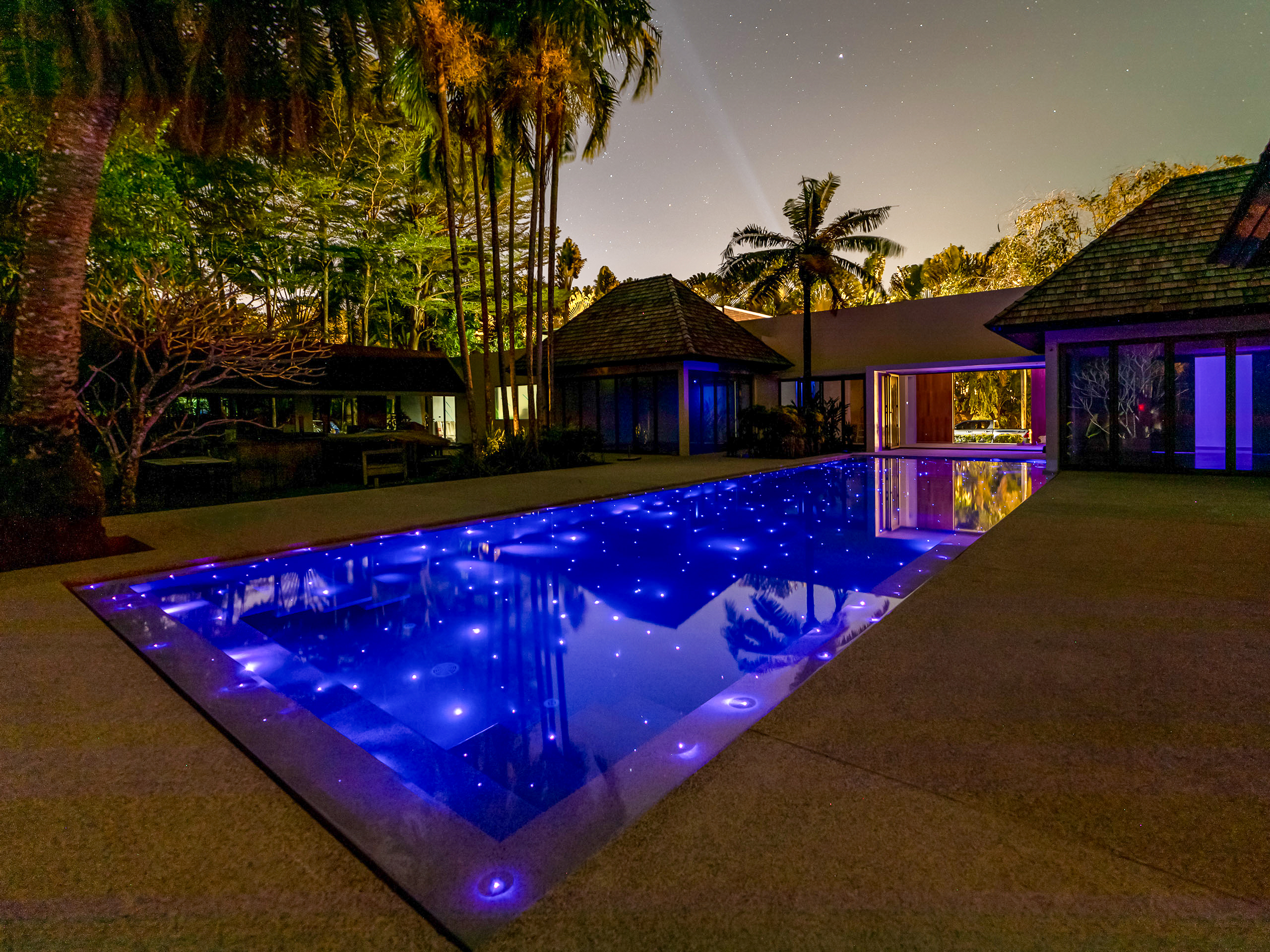 Modern infinity pool with stunning night view in Phuket